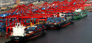 three cargo ships in shipping port