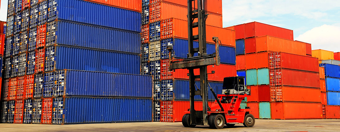 forklift with blue and red cargo containers on the background